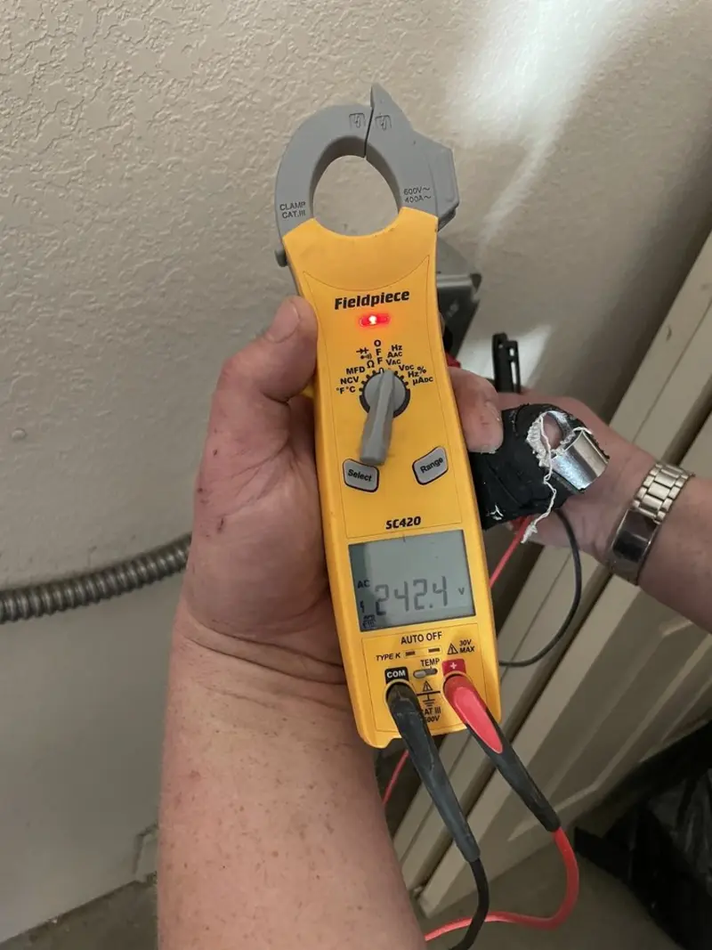 Voltage testing with clamp meter during Electrical Installation Services in Lake Stickney